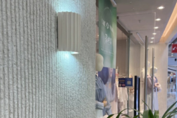 Easy Installation of Lightweight Cladding Workers easily installing lightweight flexible stone panels on a high-rise building