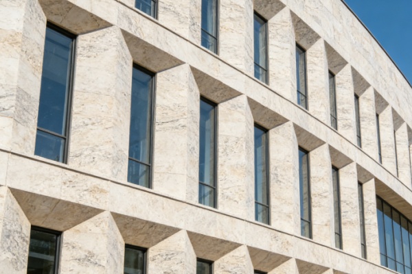 A building with a grand natural stone facade