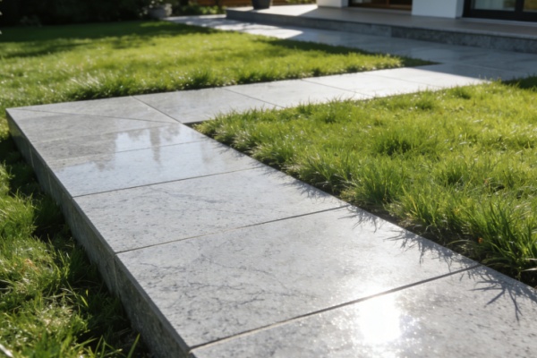 Contractor installing quartz tile pavers on a gravel base