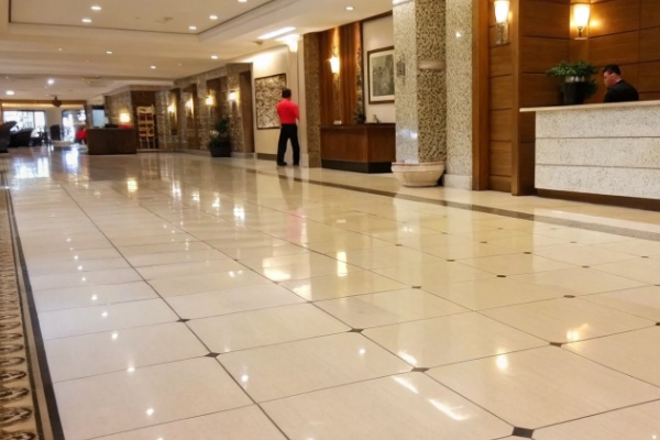 Three images side-by-side: a commercial kitchen, a luxury bathroom, and a high-traffic office floor.