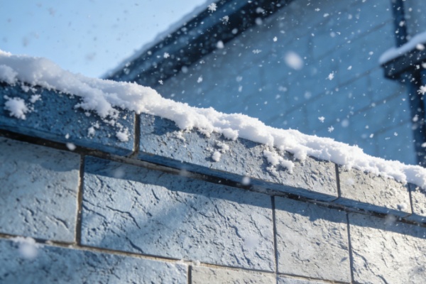 A hand bending a piece of flexible stone to show its flexibility