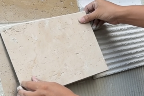Can flexible stone be installed over existing tile?