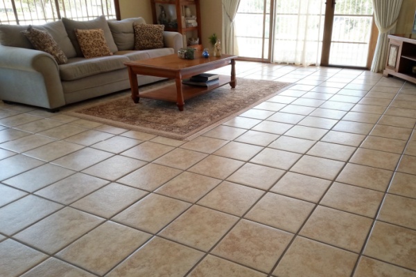 Tools for applying traditional grout on a floor