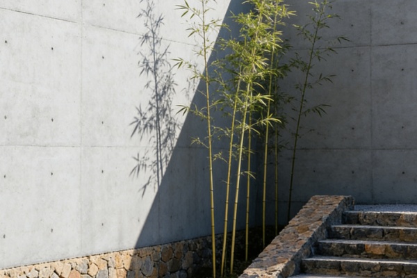 A worker easily applying a lightweight faux stone panel to a wall with adhesive