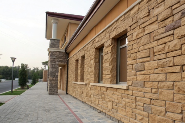 A wall covered in manufactured stone veneer with a slightly artificial look