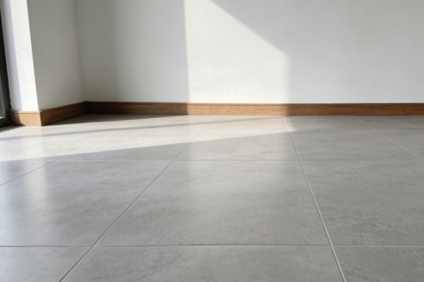 A cross-section view of a dense porcelain tile and a more porous ceramic tile