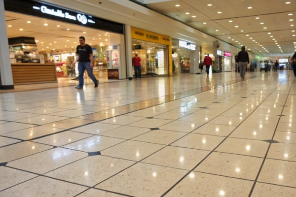 Textured glazed porcelain tiles on the floor of a busy cafe