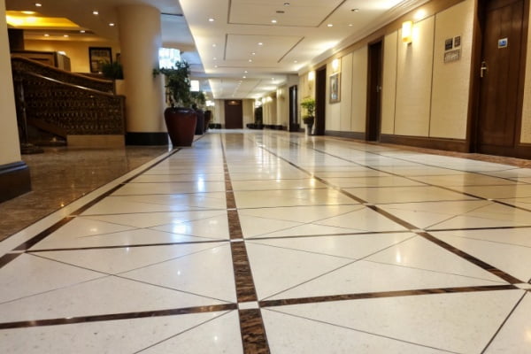 A clean, modern office with 800x800mm light grey porcelain tiles